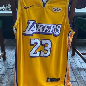 NBA official Swingman yellow and purple Lakers Lebron James #23 jersey.